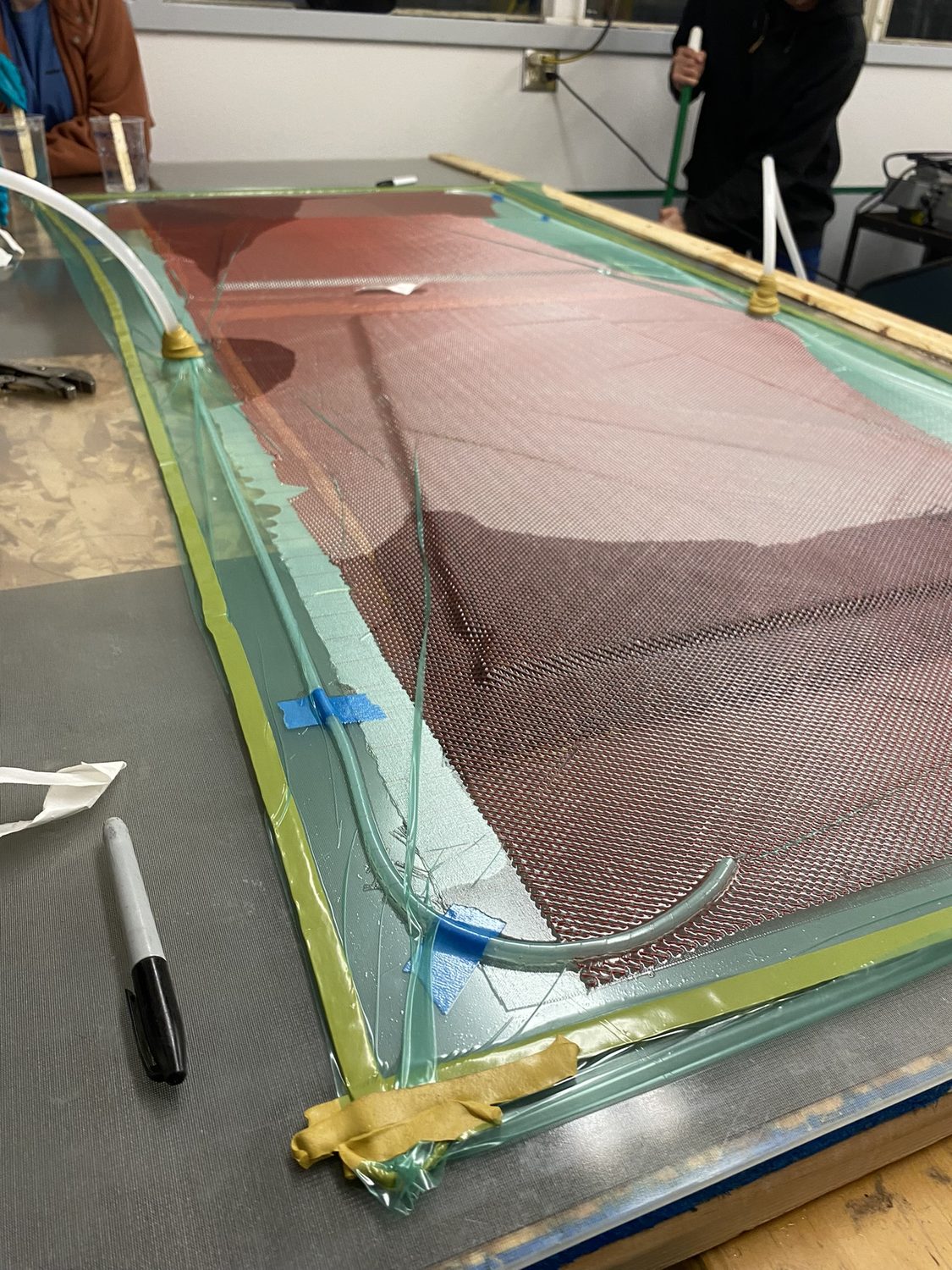 Composite skid plate vacuum infusion
